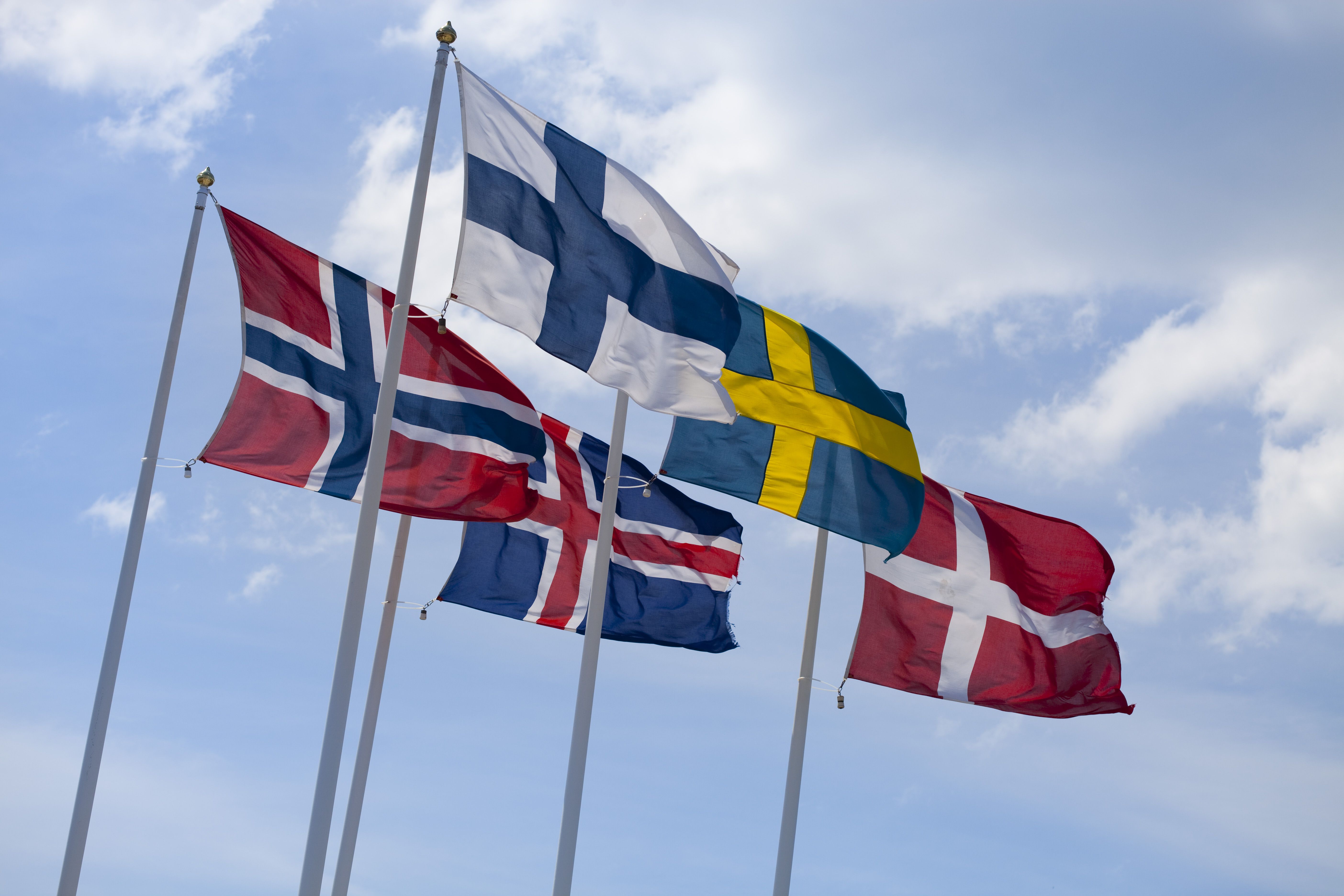 The Official And Unofficial Flags In Scandinavia   Flags Of The Nordic Countries On Flag Poles Against Blue Sky 173937956 597a0f95519de20011c2bcf5 