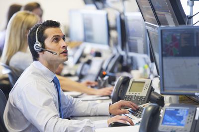 Securities traders enjoy fast-paced, high paying careers.