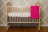 Nursery with Harlequin Patterned Wall.