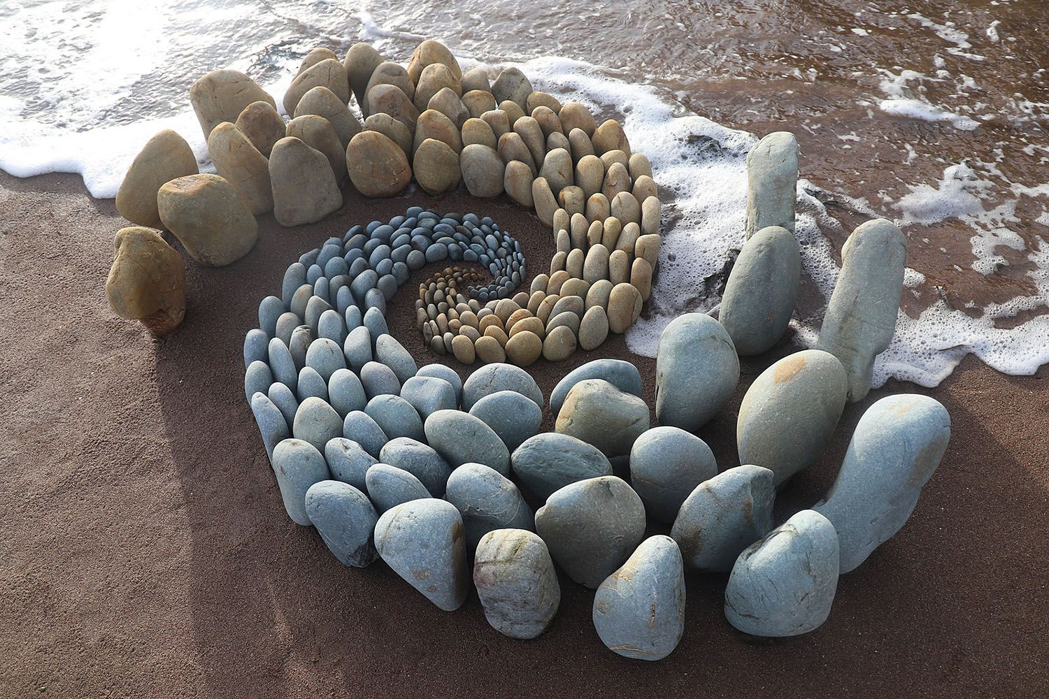 Sculptor Weaves Stones