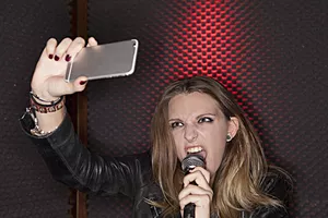Singer taking a selfie