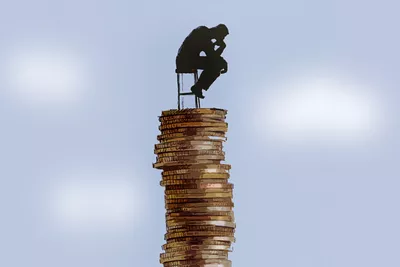 Sitting on stack of coins